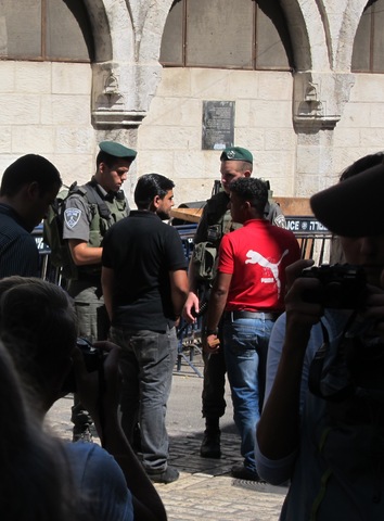 During our tour through the Old City of Jerusalem, Israeli soldiers are controlling Palestinians for their documents at the Via Dolorosa.